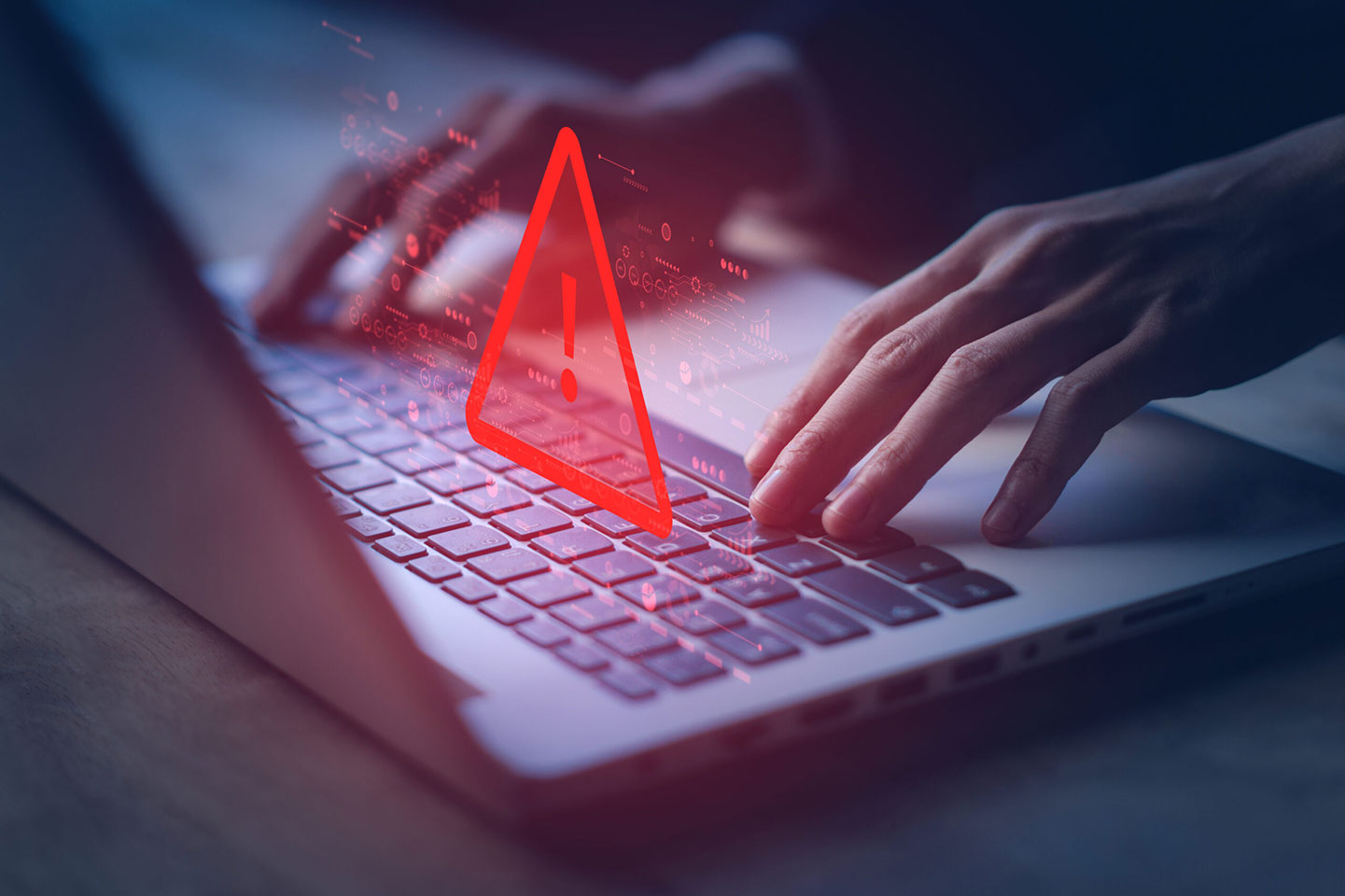 laptop and warning sign, cloning scams
