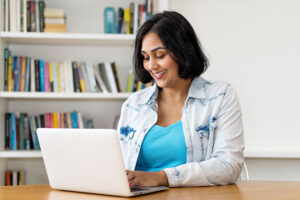 woman looking at her pension on laptop
